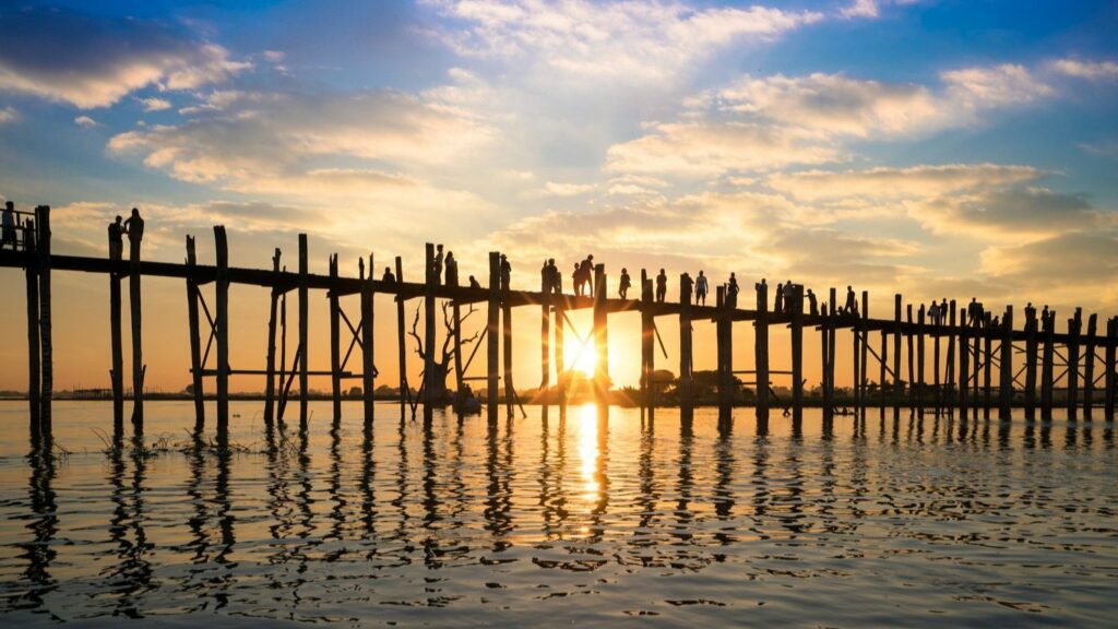 silhouette people walking during sunset u bein bridge mandalay myanmar
