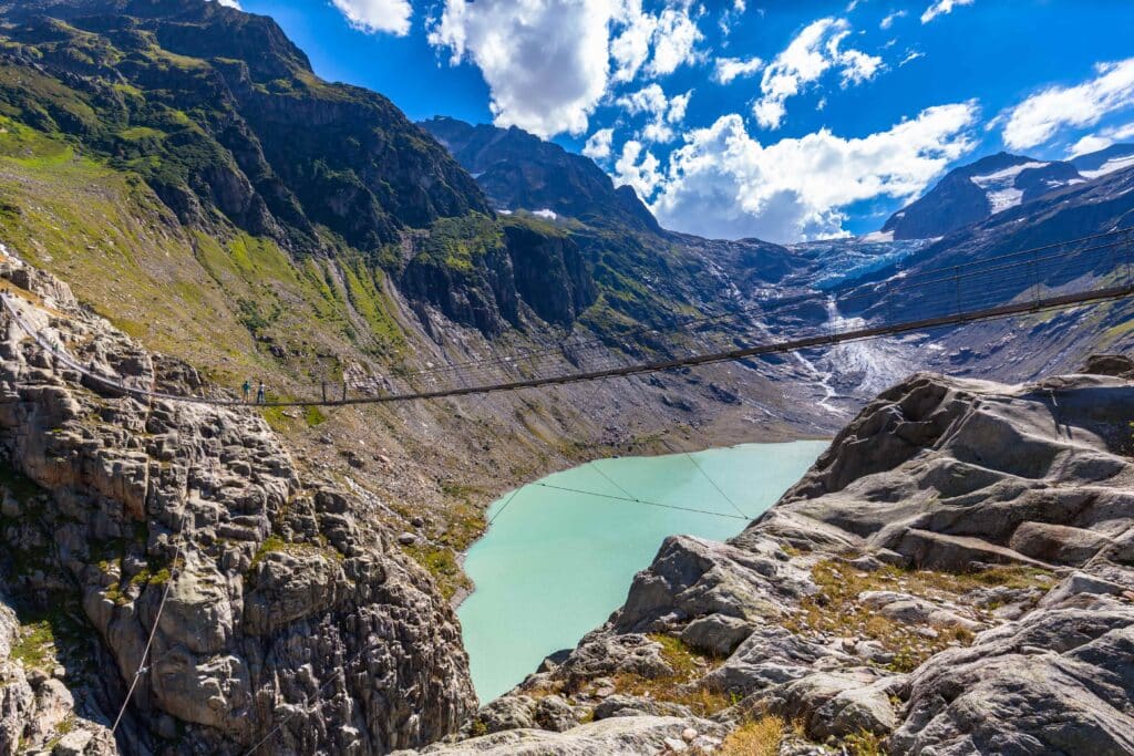 wsi imageoptim Canva Stunning view of Trift bridge over the lake and glacier min 1 1024x683 1